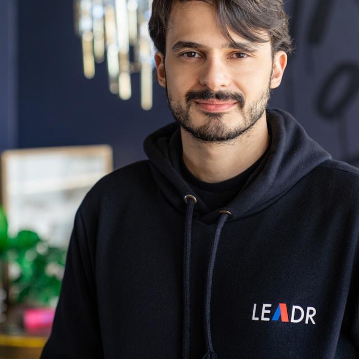 Kaveri Mehta, Lead Design Curator at Primrose & Co., reviewing corporate floral arrangements